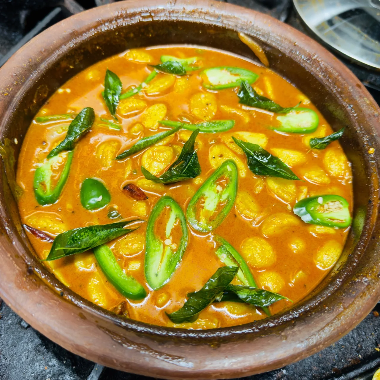 Sri Lankan garlic curry prepared at 52 South in Rosetta